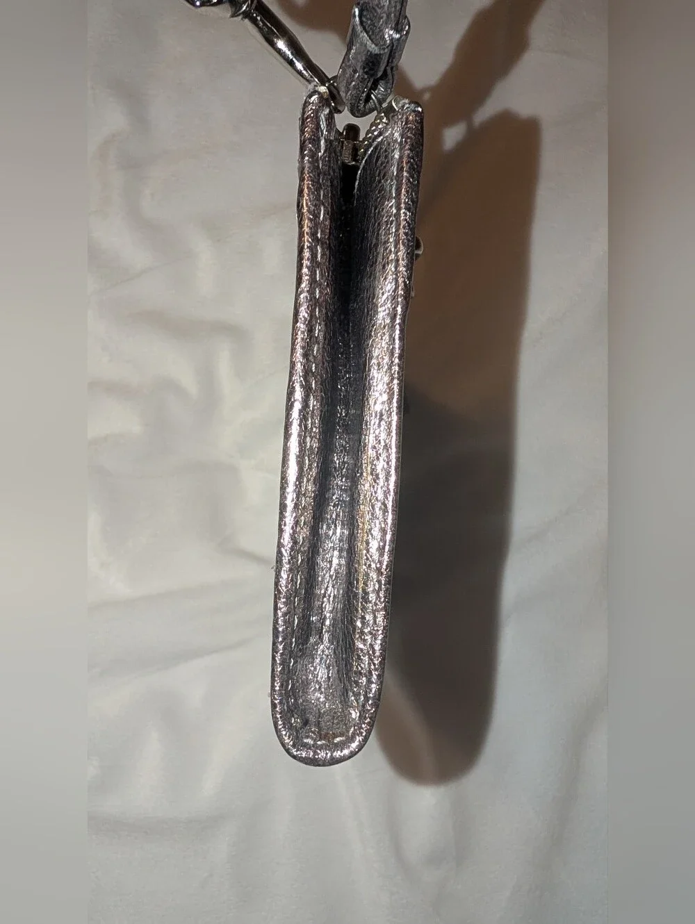 Coach sleek metallic